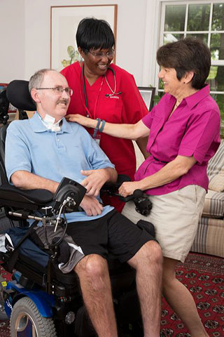 BAYADA client Eric with his wife Amy and nurse Sharon